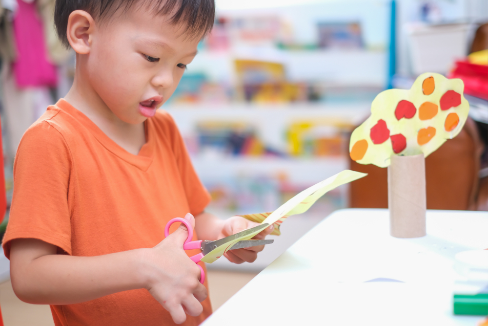 Use-scissors-as-a-pre-writing-toddler-activity